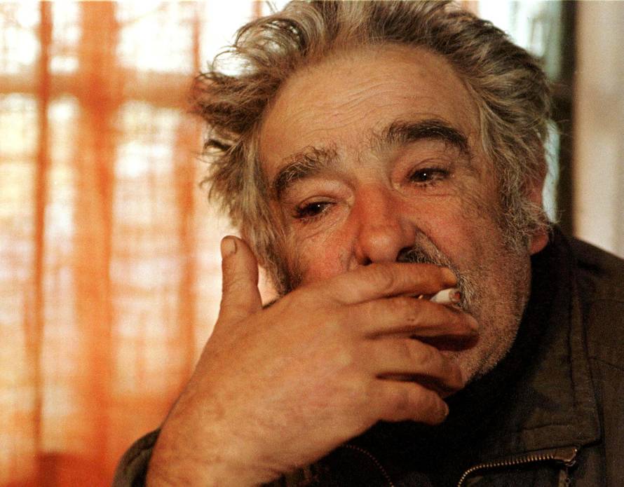 FILE PHOTO: FORMER GUERRILLA LEADER JOSE MUJICA SMOKES DURING A INTERVIEW.