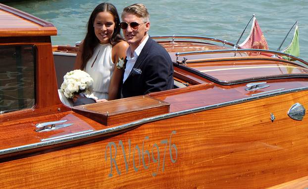 German football player Schweinsteiger and Serbian tennis player Ivanovic sit in a boat after get married in Venice
