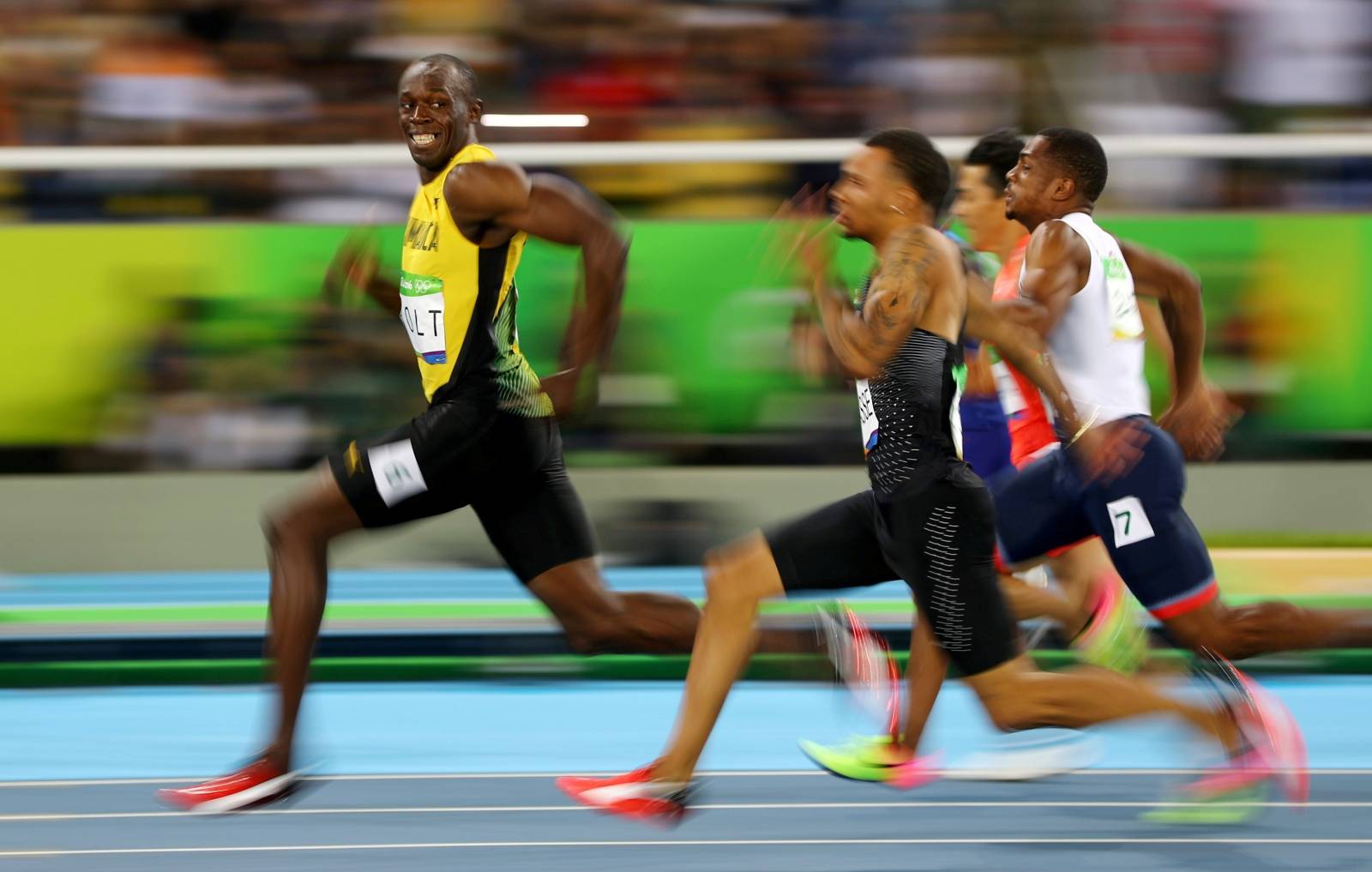 FILE PHOTO: Usain Bolt (JAM) of Jamaica looks at Andre De Grasse (CAN) of Canada as they compete in the 2016 Rio Olympics, Men's 100m Semifinals at the Olympic Stadium in Rio de Janeiro