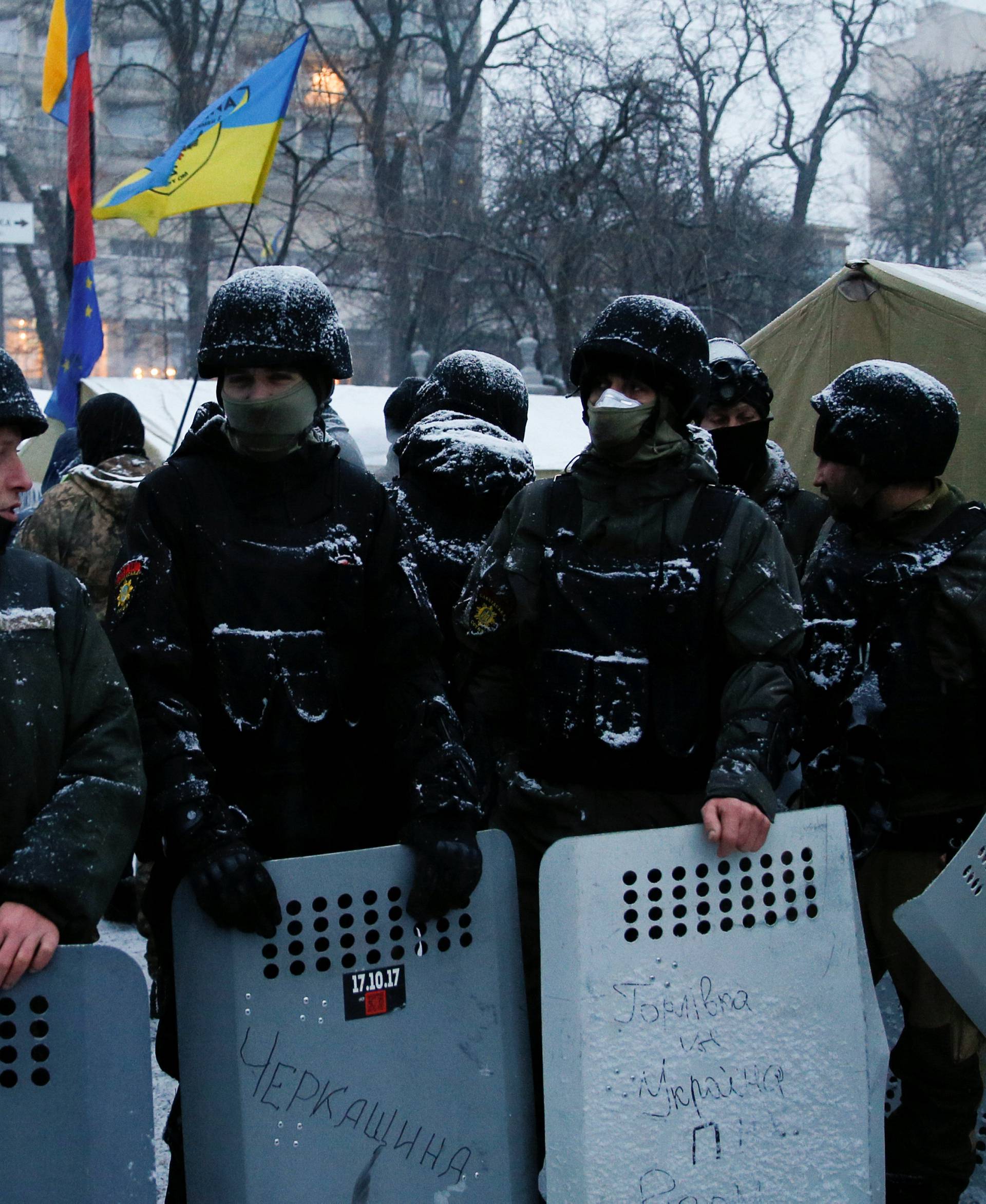 Anti-government protesters gather in front of the Parliament building in Kiev