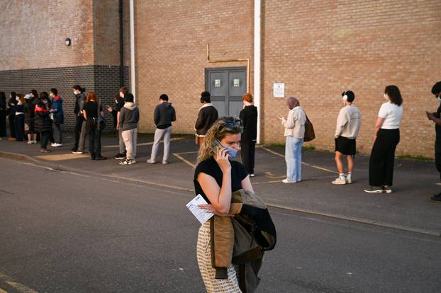 People queue to receive vaccinations at the Sports centre on the University of Kent campus, following an outbreak of meningitis cases in Kent