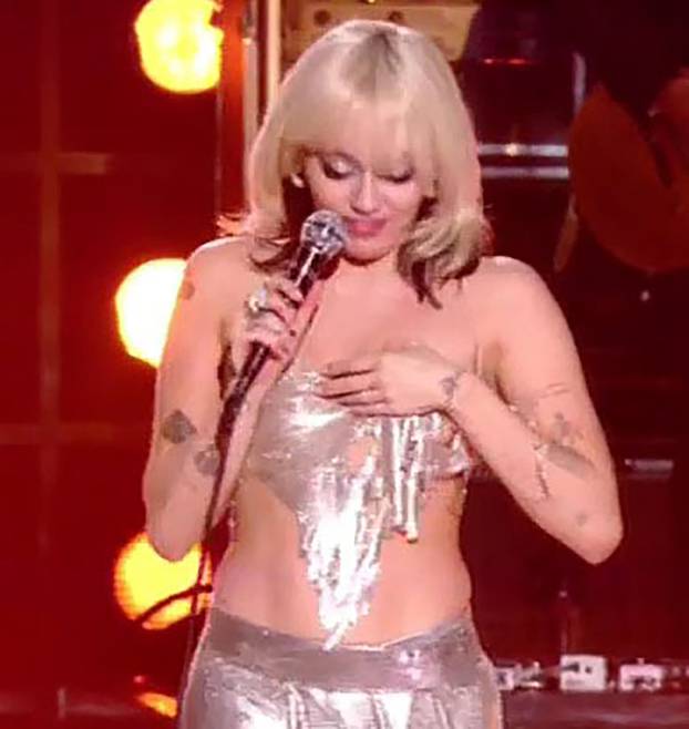 Miley Cyrus has a major wardrobe malfunction and almost exposes her boob as she performs on stage at her NBC special Miley Cyrus