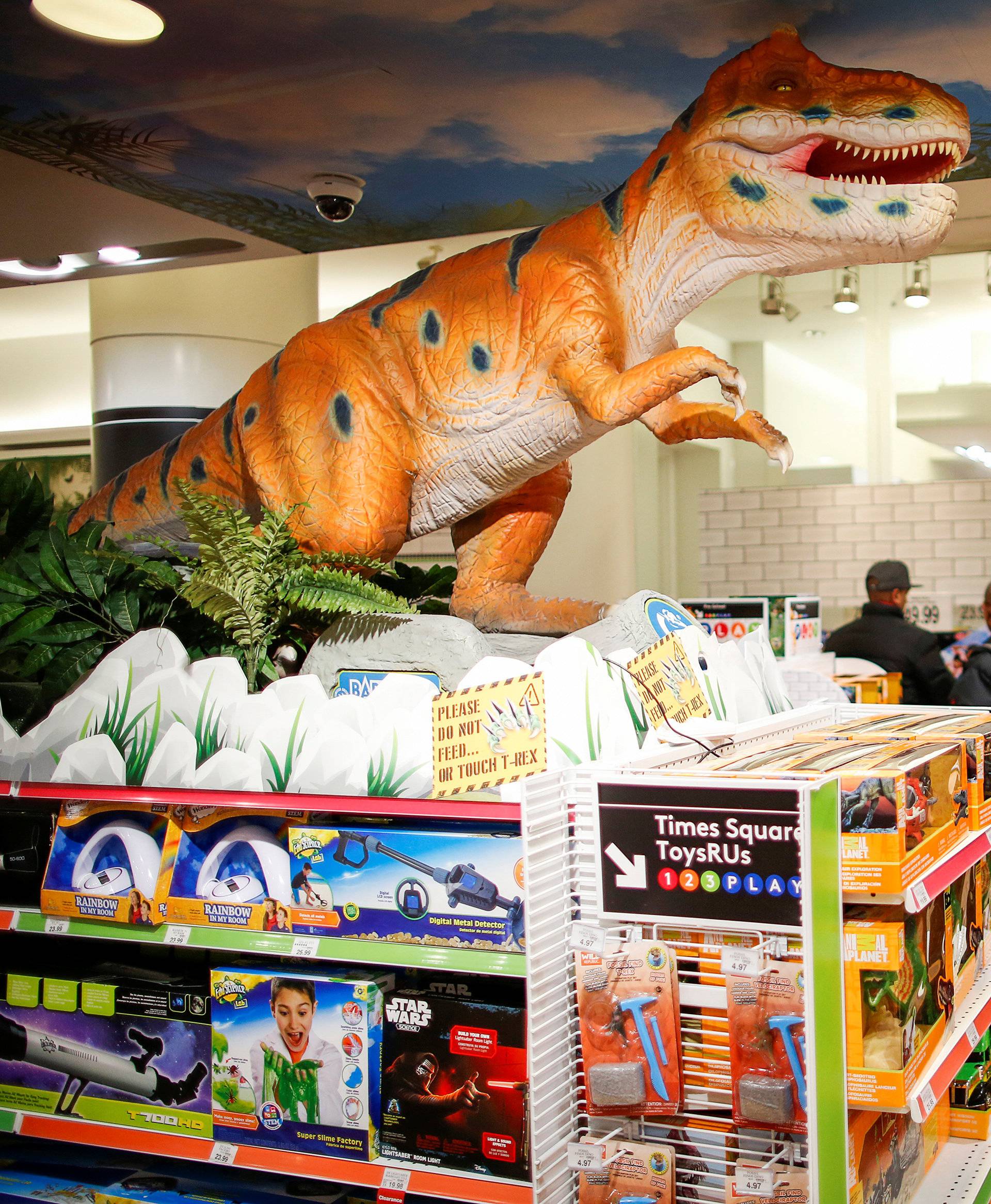 FILE PHOTO -  People visit a Toys R Us store at Times Square in New York