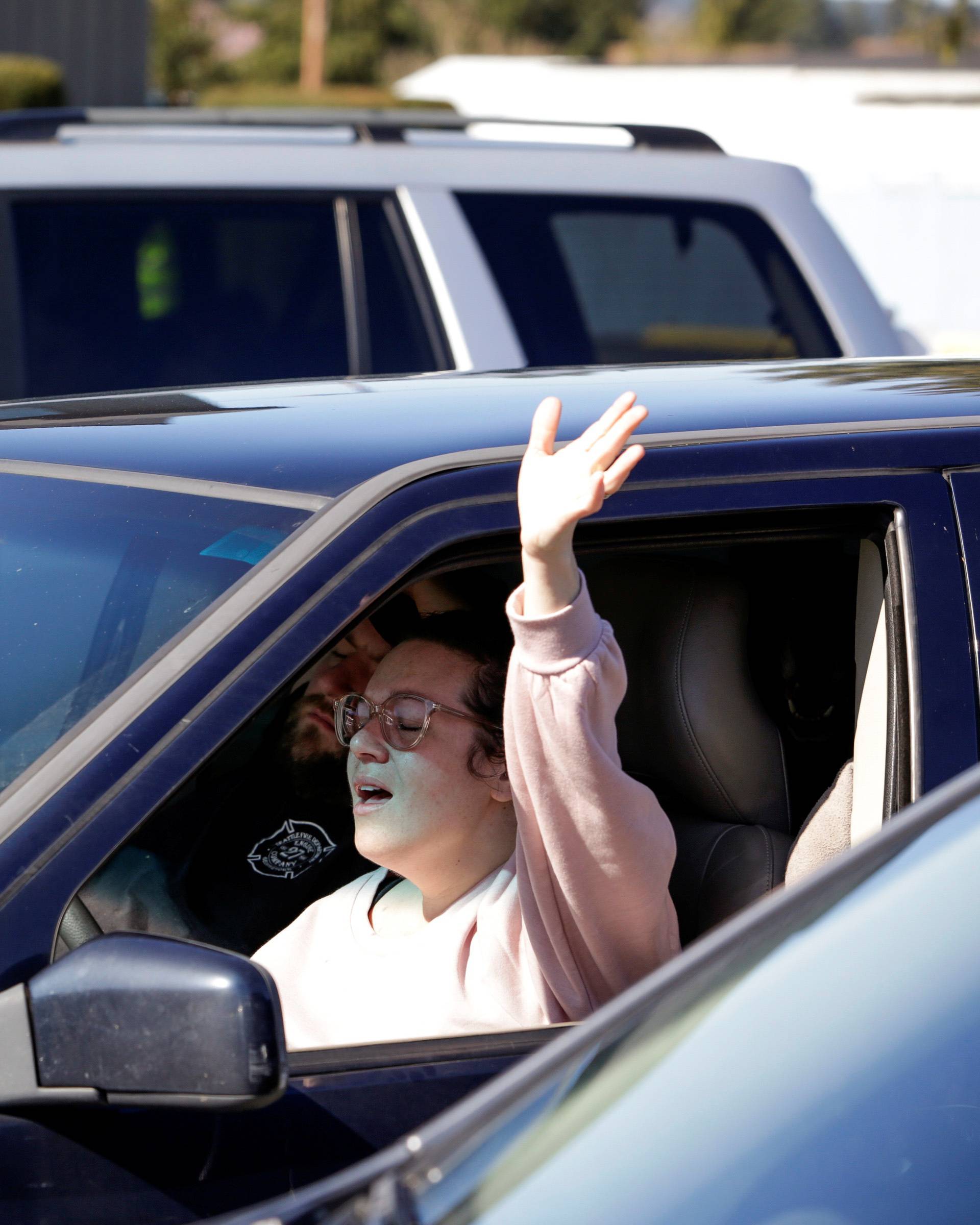 Hopkins worships during a "drive-in" church service at The Grove Church after large gatherings were banned due to the coronavirus outbreak in Marysville