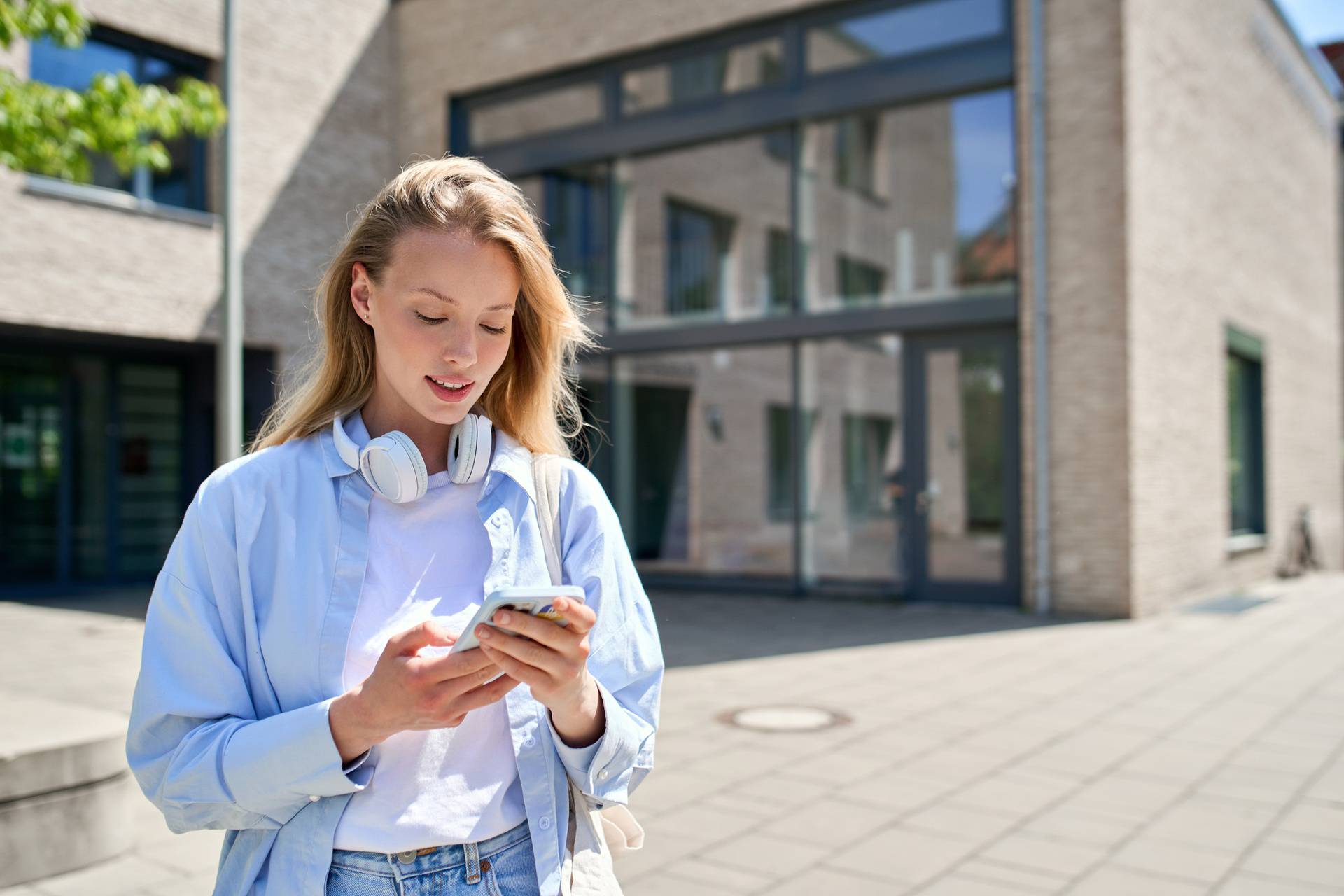 Beautiful,Cool,Girl,University,Student,Holding,Cell,Phone,Using,Modern