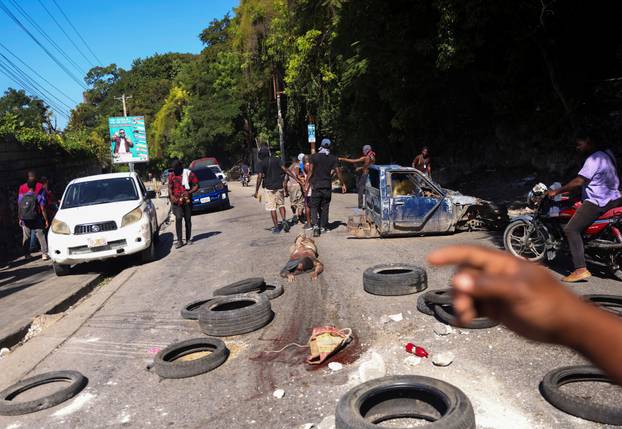 Over two dozen killed as gangs attempt to attack Haiti suburb