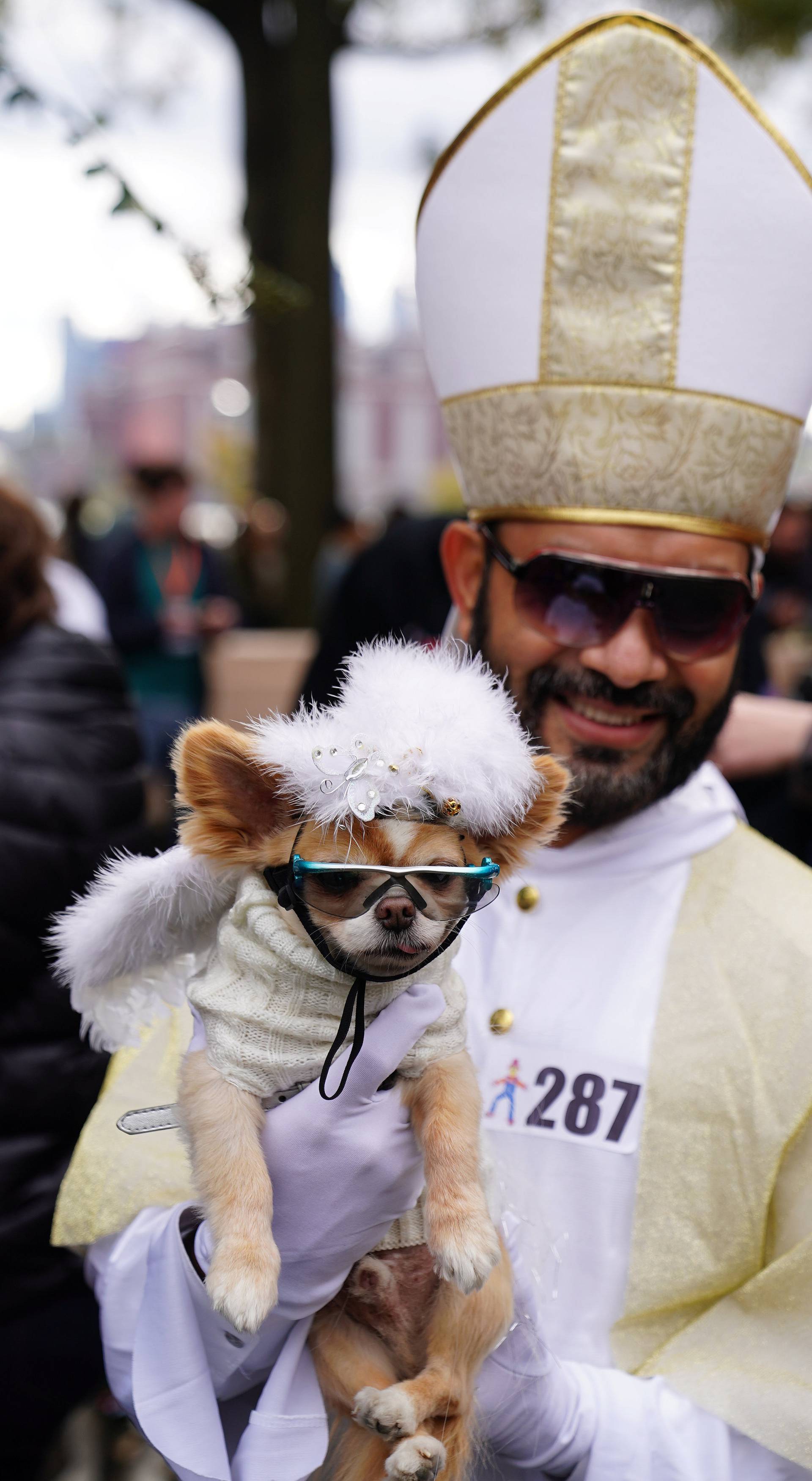 People attend the Tompkins Square Park Halloween Dog Parade at East River Park in the Manhattan borough of New York City