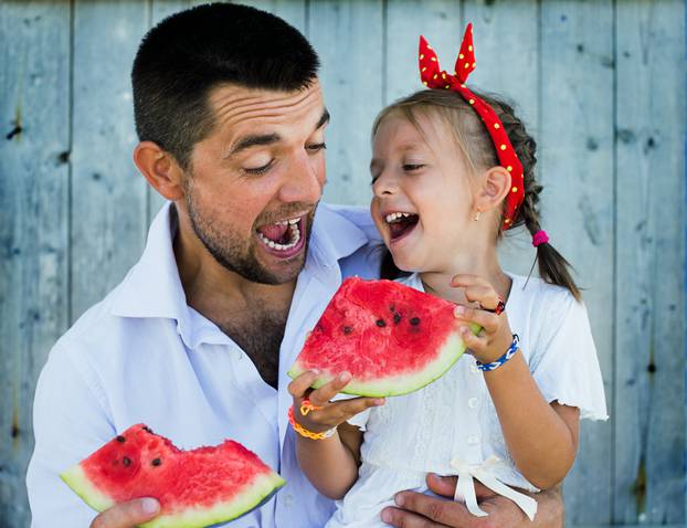 Happy,Father,Playing,With,Cute,Little,Daughter,Holding,Watermelon