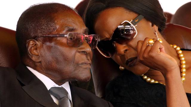 Mugabe and his wife Grace attend the burial of two independence luminaries in Harare