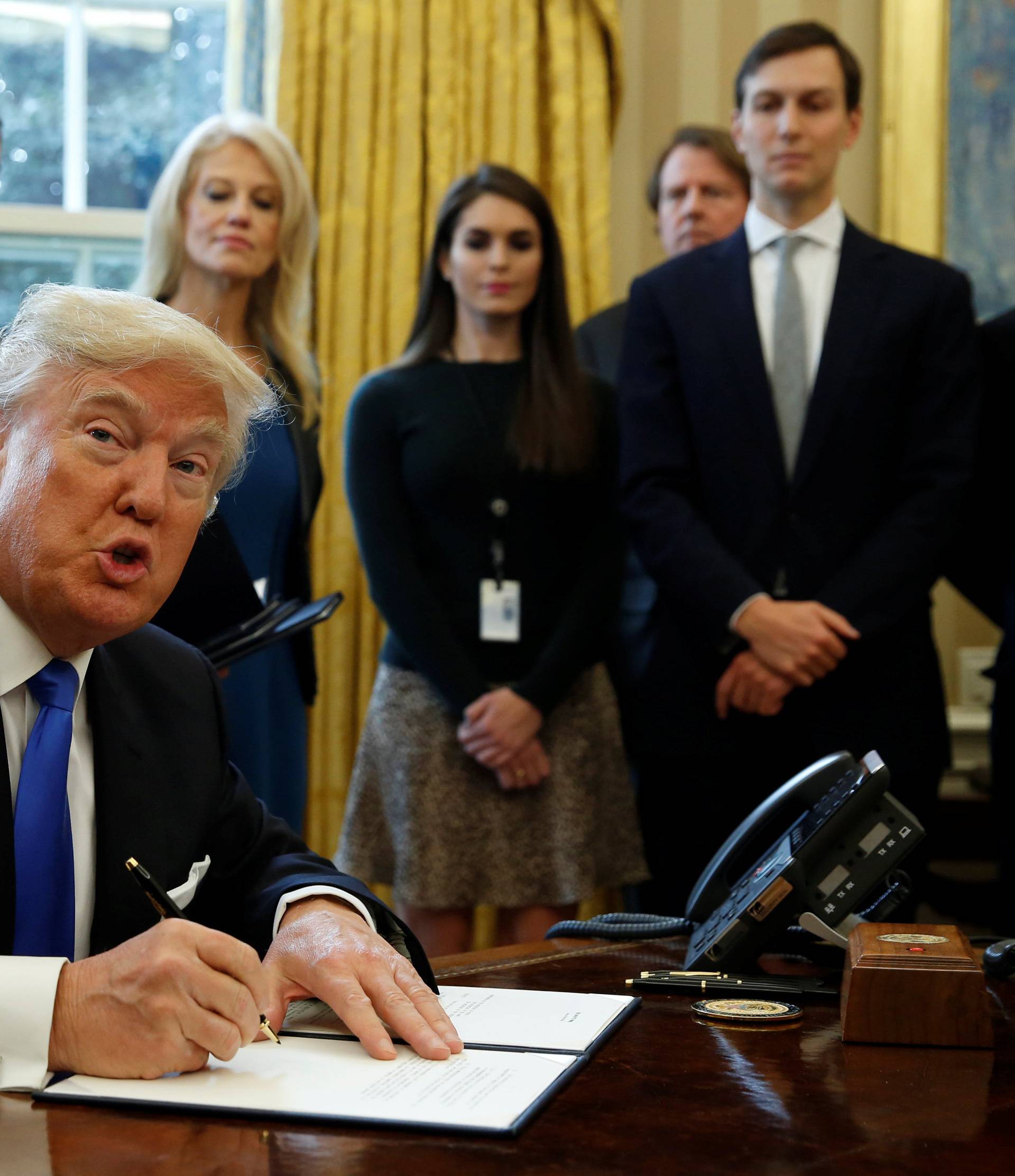 President Trump signs executive orders at the White House in Washington
