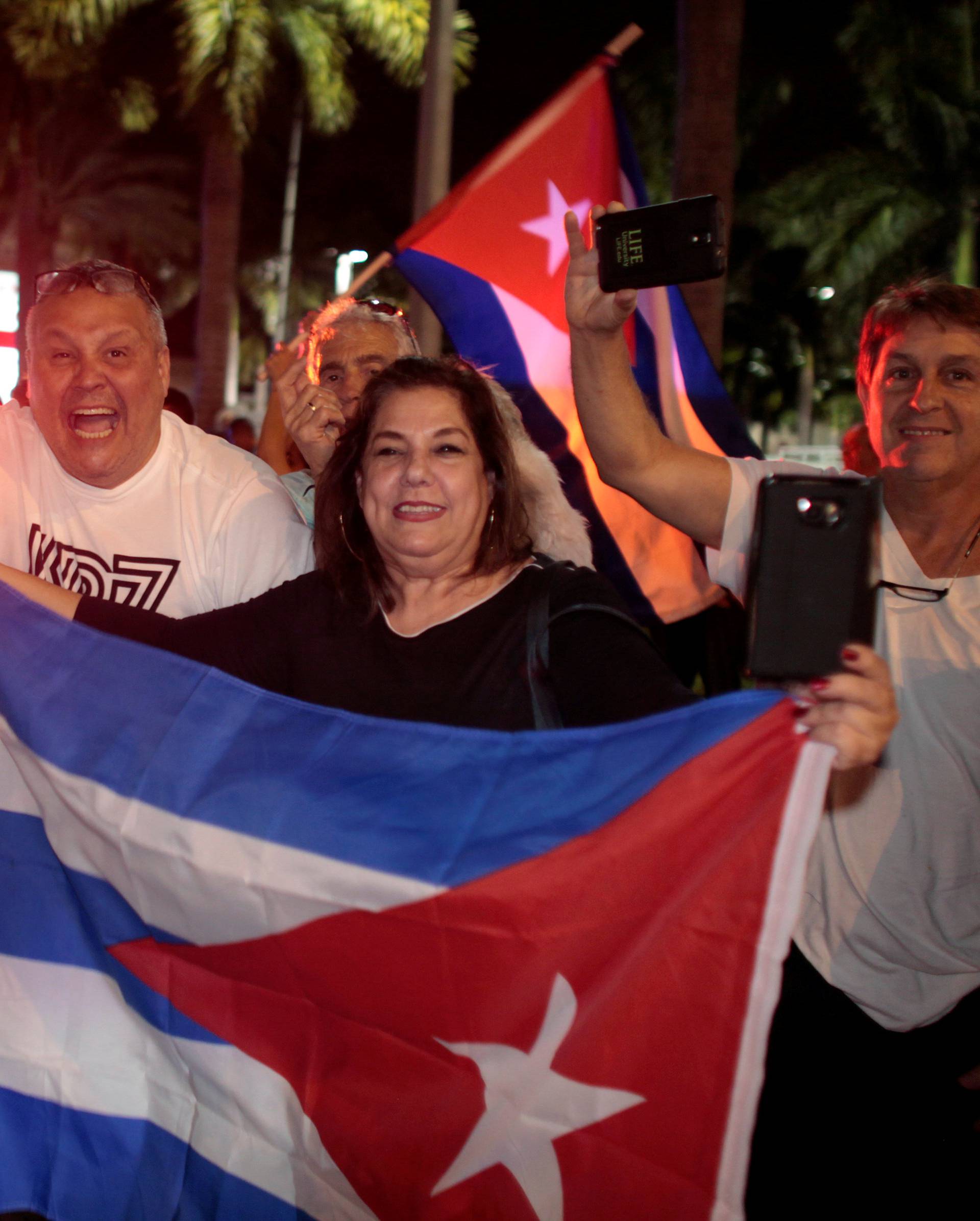 People celebrate after the announcement of the death of Cuban revolutionary leader Fidel Castro in the Little Havana district of Miami