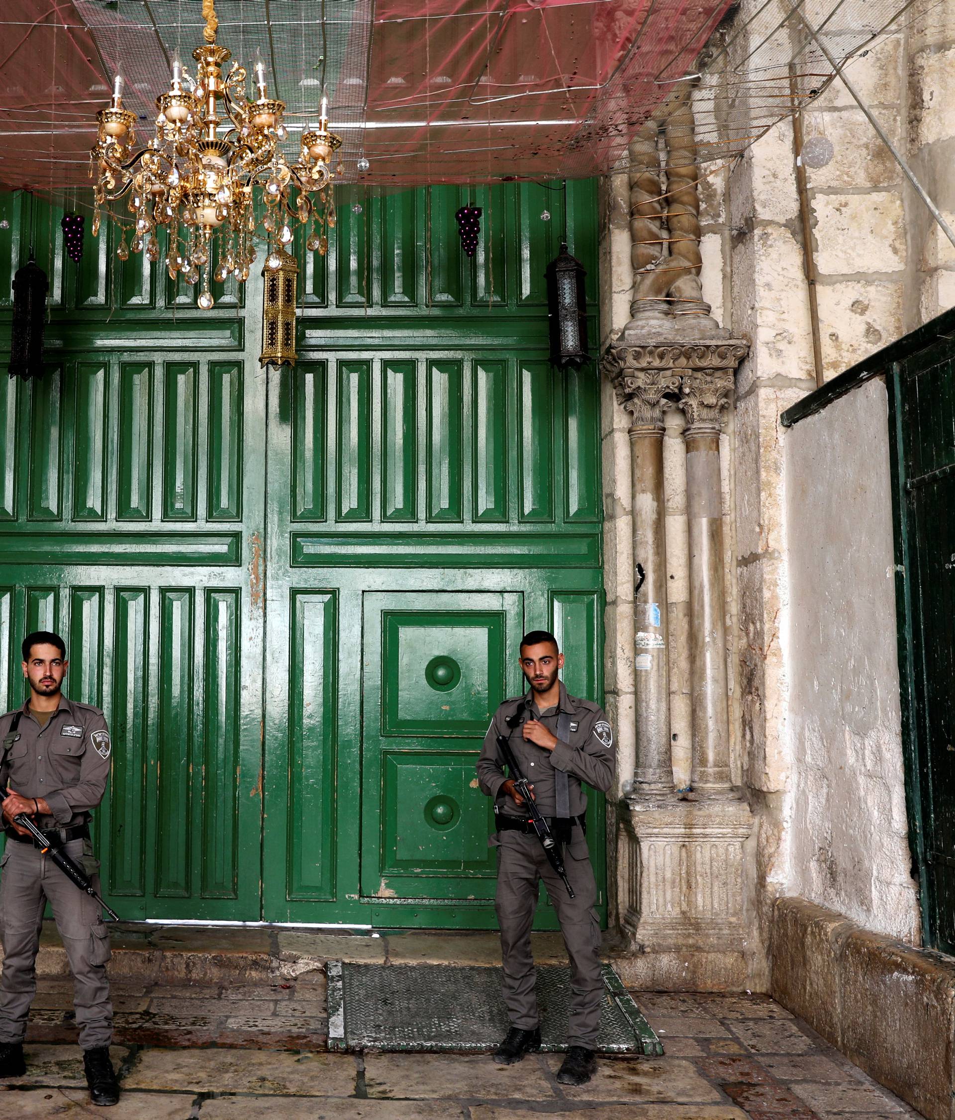 Israeli border policemen secure the entrance to the compound known to Muslims as Noble Sanctuary and to Jews as Temple Mount, in Jerusalem's Old City