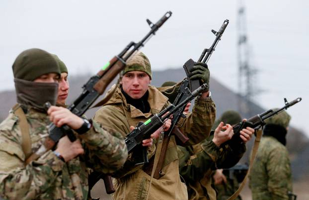 FILE PHOTO: Militants of the self-proclaimed Donetsk People's Republic train at a range in Donetsk