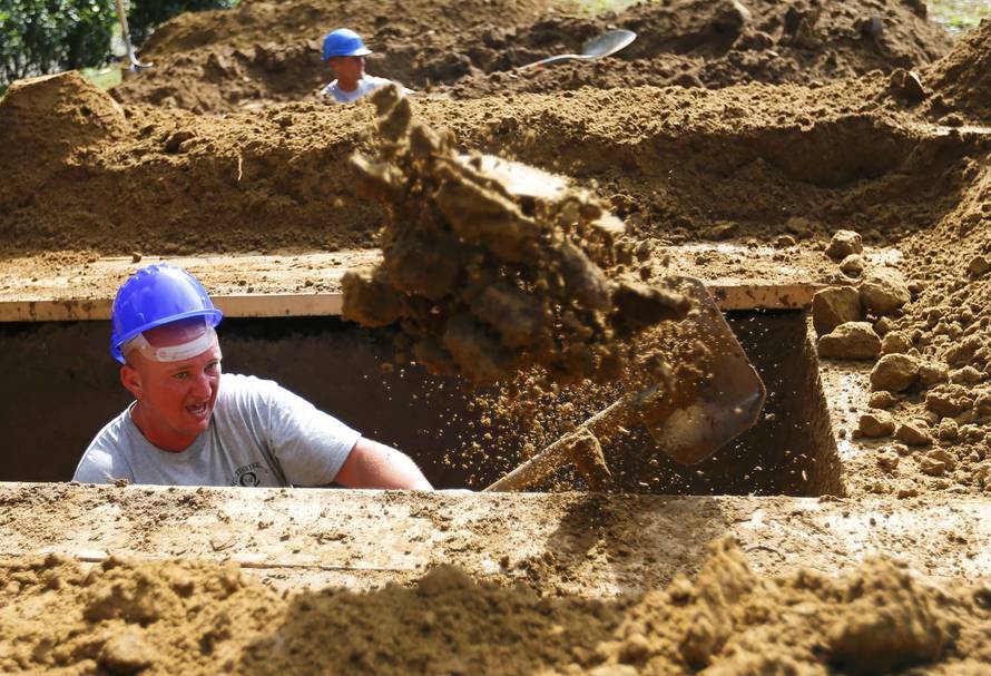 Gravedigger competes in Hungarian grave digging championship in Debrecen
