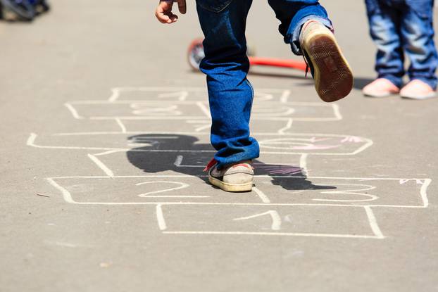 Kids,Playing,Hopscotch,On,Playground,Outdoors