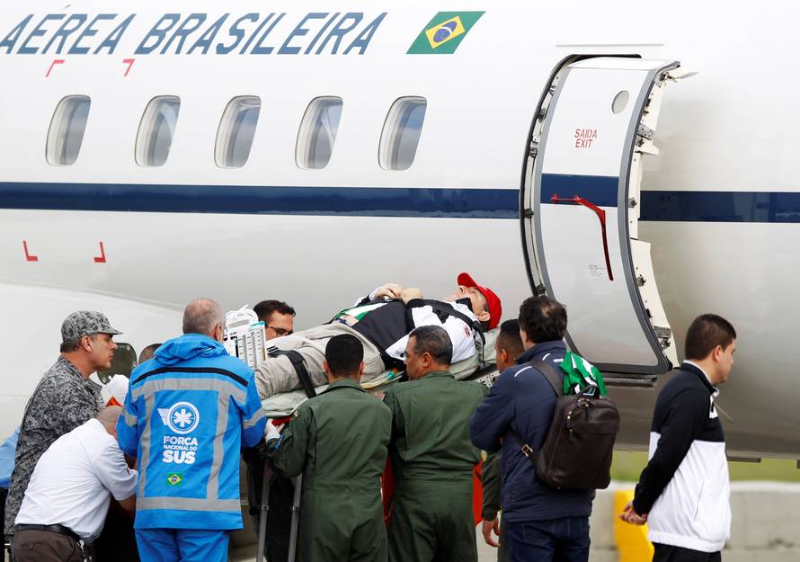 Brazilian radio journalist Rafael Henzel is being loaded into a plane of Brazilian's Air Force for his return to Brazil, after he survived a plane crash with Brazilian soccer team Chapecoense aboard, in Rionegro