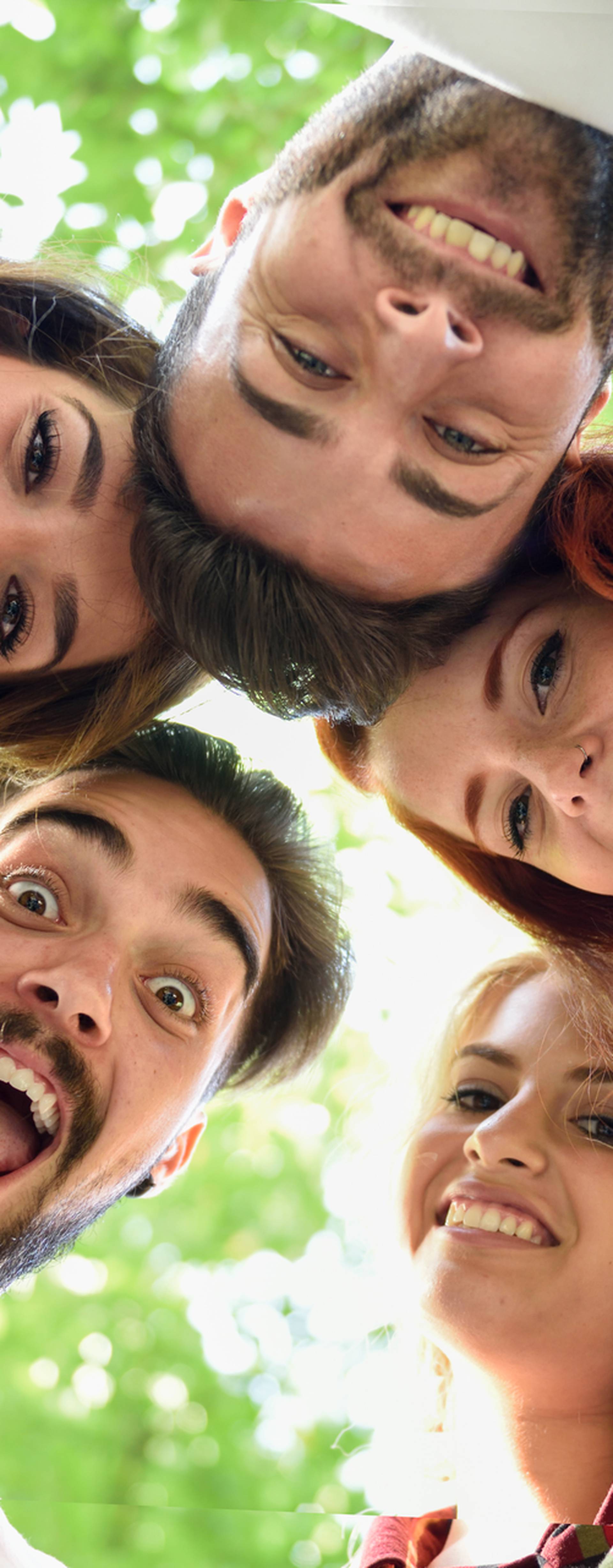 Group of young people together outdoors in urban background