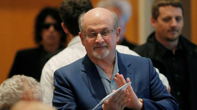 FILE PHOTO: Author Salman Rushdie arrives for the PEN New England's Song Lyrics of Literary Excellence Award ceremony at the John F. Kennedy Library in Boston