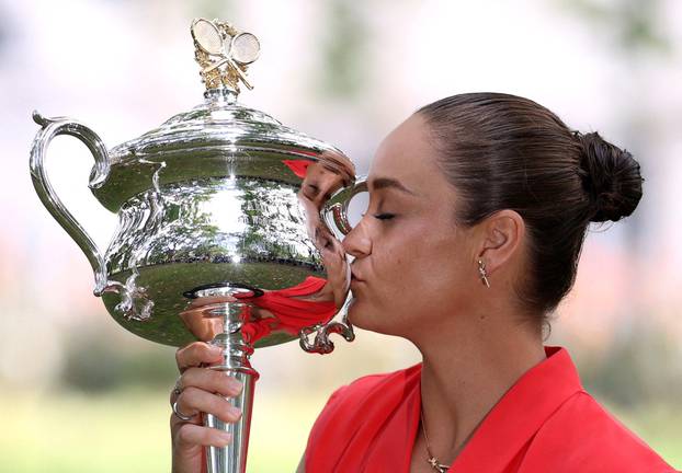 FILE PHOTO: Australian Open champion Australia's Ashleigh Barty poses with the trophy during a photo shoot at the Royal Exhibition Building in Melbourne