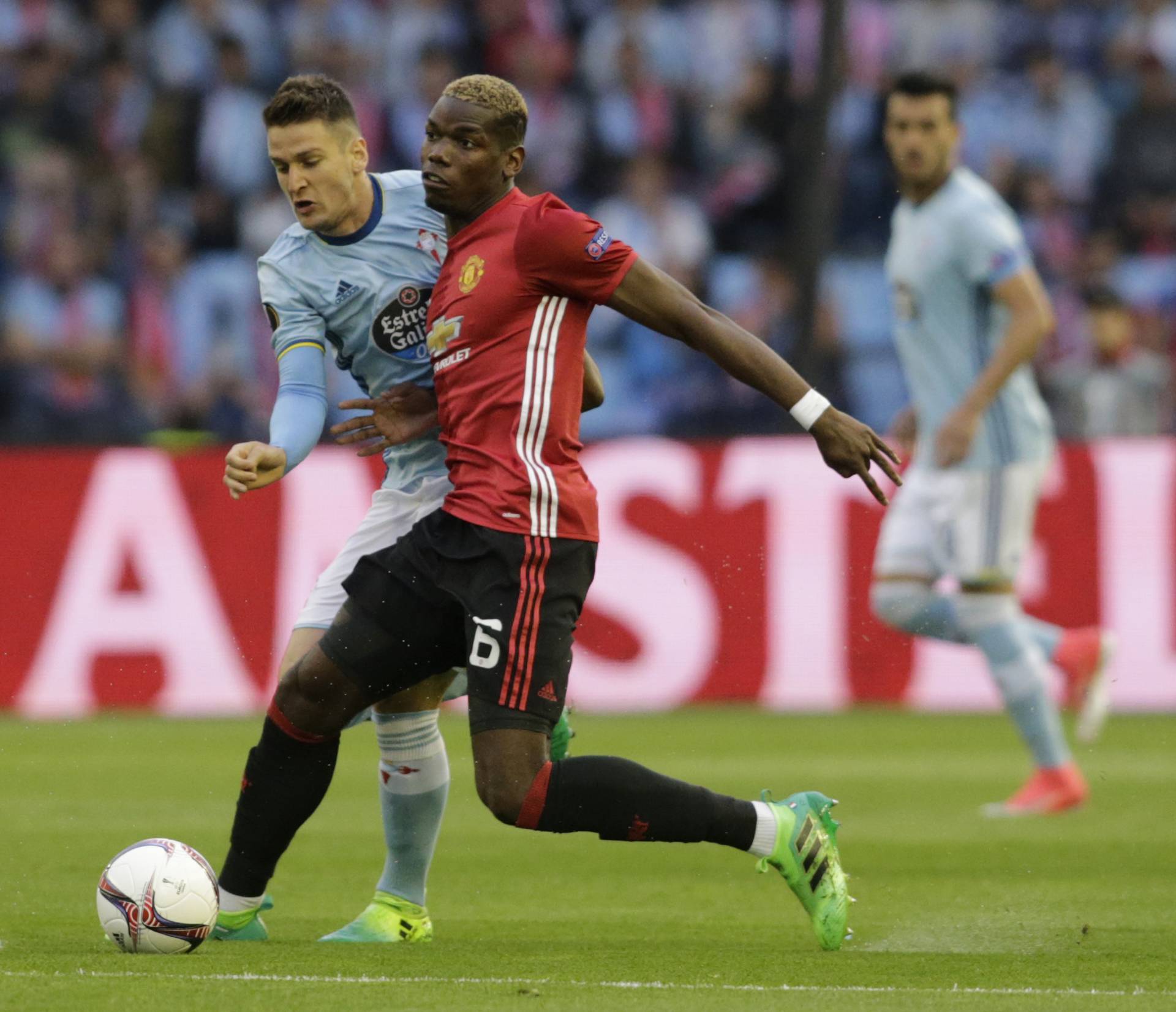 Celta Vigo's Nemanja Radoja in action with Manchester United's Paul Pogba