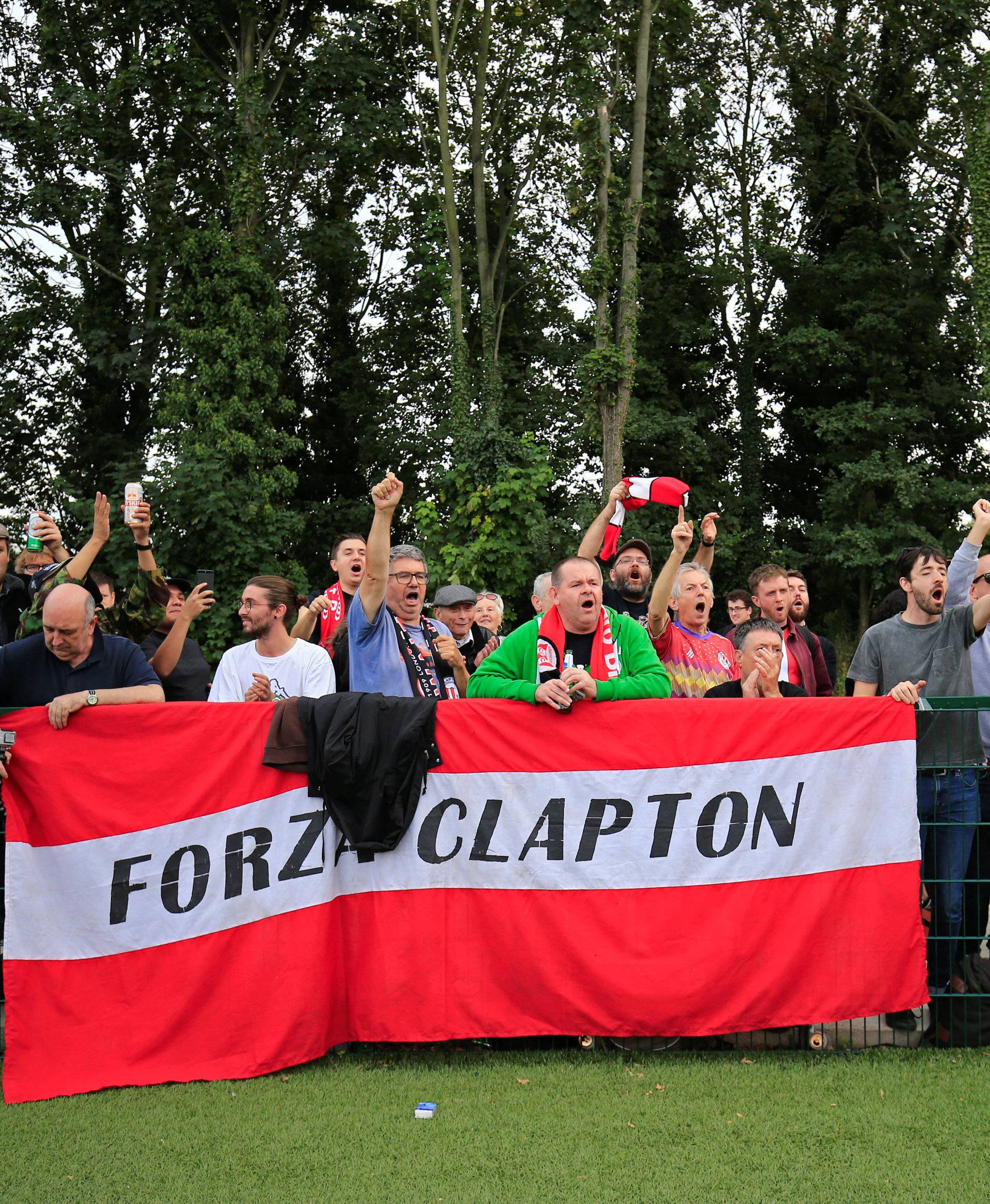 Clapton CFC supporters react after their team won 2-0 in away game against Healing Town in East Acton, in London, Britain