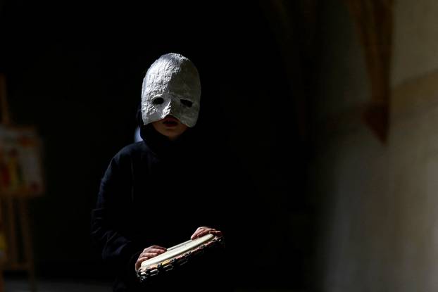 A child wearing a mask prepares to march through the streets during Easter celebrations in Ceske Budejovice, Czech Republic, April 15, 2022. REUTERS/David W Cerny Photo: DAVID W CERNY/REUTERS