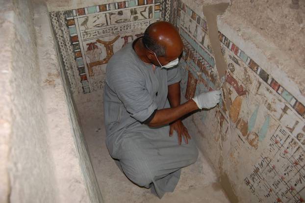 An Egyptian employee works at the 4,000-year-old tomb of Meru, the oldest site accessible to the public on Luxor's West Bank