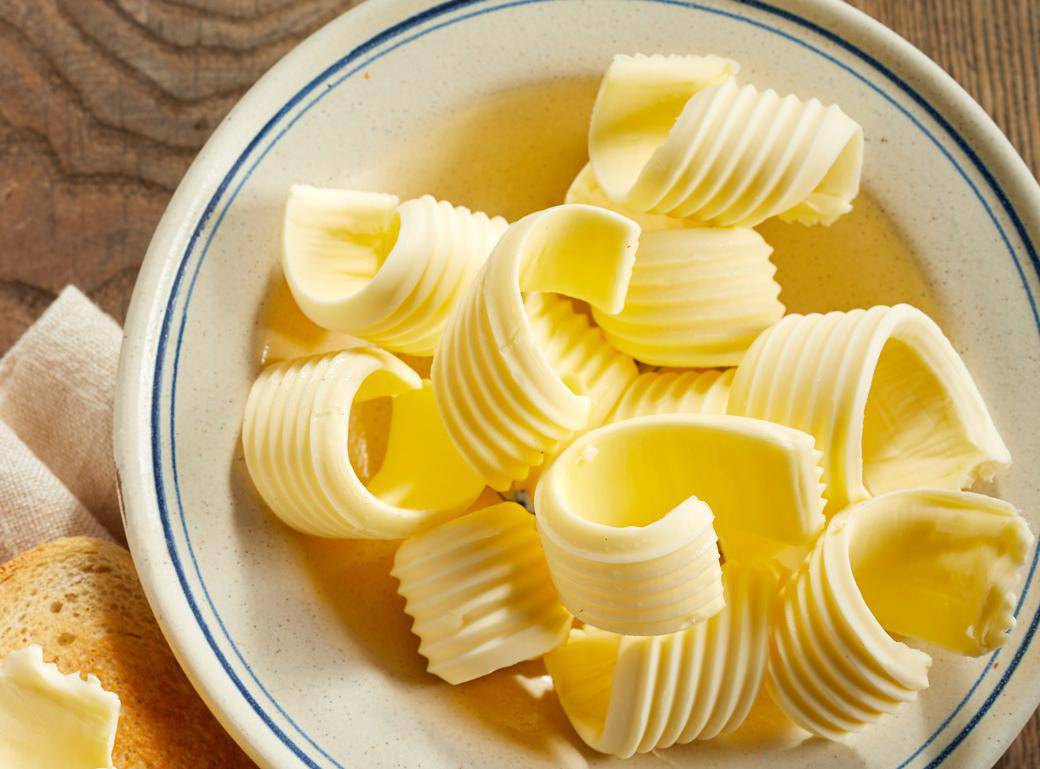 Dish of butter curls with crispy golden toast