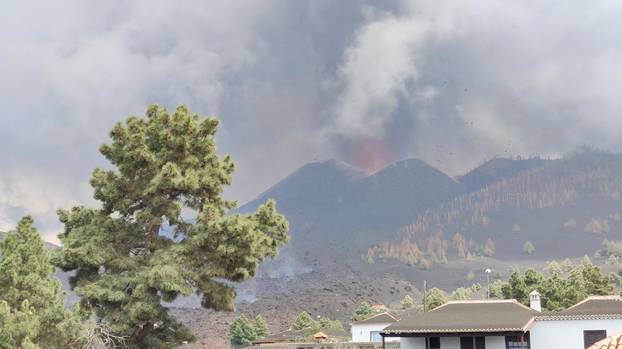 A cloud of smoke and ash is seen as volcanic explosions intensified on the Canary Island of La Palma