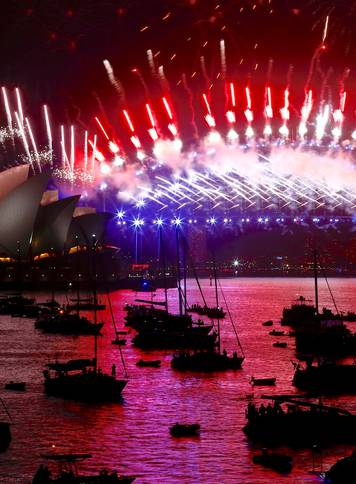 Fireworks light up the Sydney Harbour Bridge and Sydney Opera House during new year celebrations on Sydney Harbour