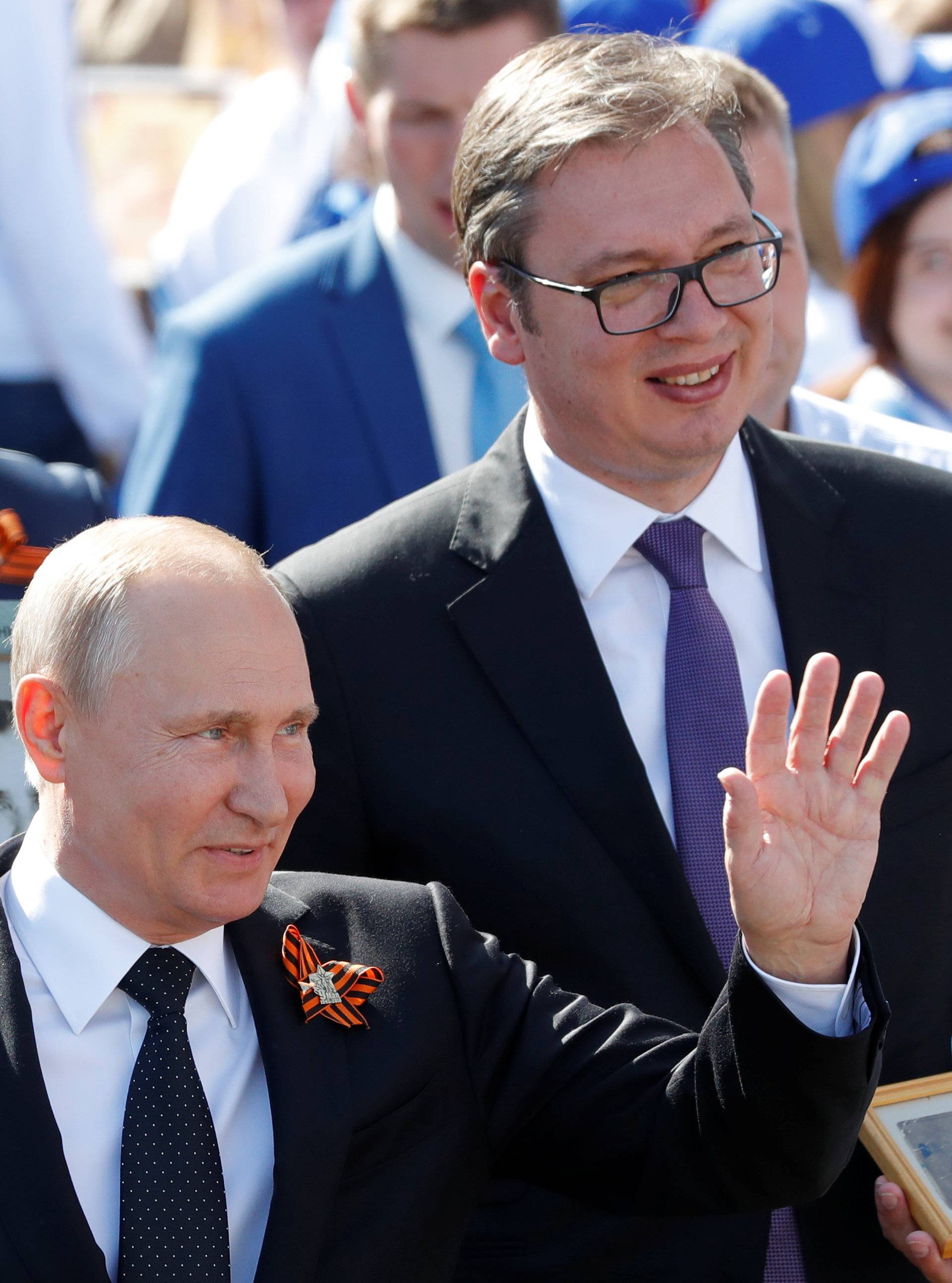 Russian President Putin and his Serbian counterpart Vucic attend the Immortal Regiment march during the Victory Day celebrations in central Moscow