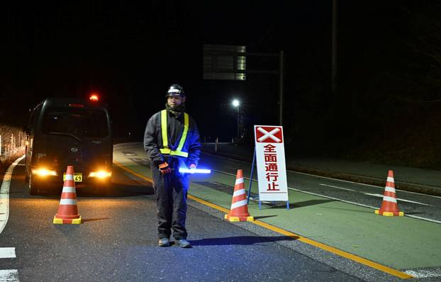Traffic is restricted on a road following the issuance of a tsunami warning in Rikuzentakata
