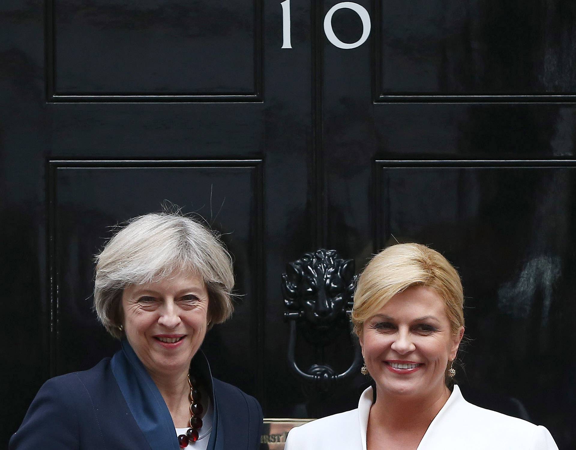Britain's Prime Minister Theresa May greets Croatia's President Kolinda Grabar-Kitarovic at Downing Street in London