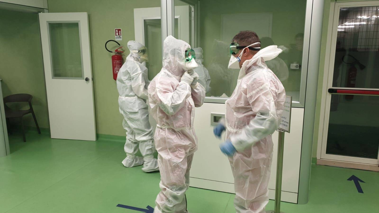 Medical personnel at Rome's Fiumicino airport prepare to check passengers arriving from China's Wuhan for signs of coronavirus in Rome