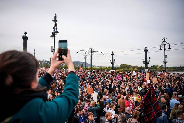 People take part in a protest in support of teachers fighting for higher wages and teachers sacked for protesting, at the Margaret Bridge, in Budapes