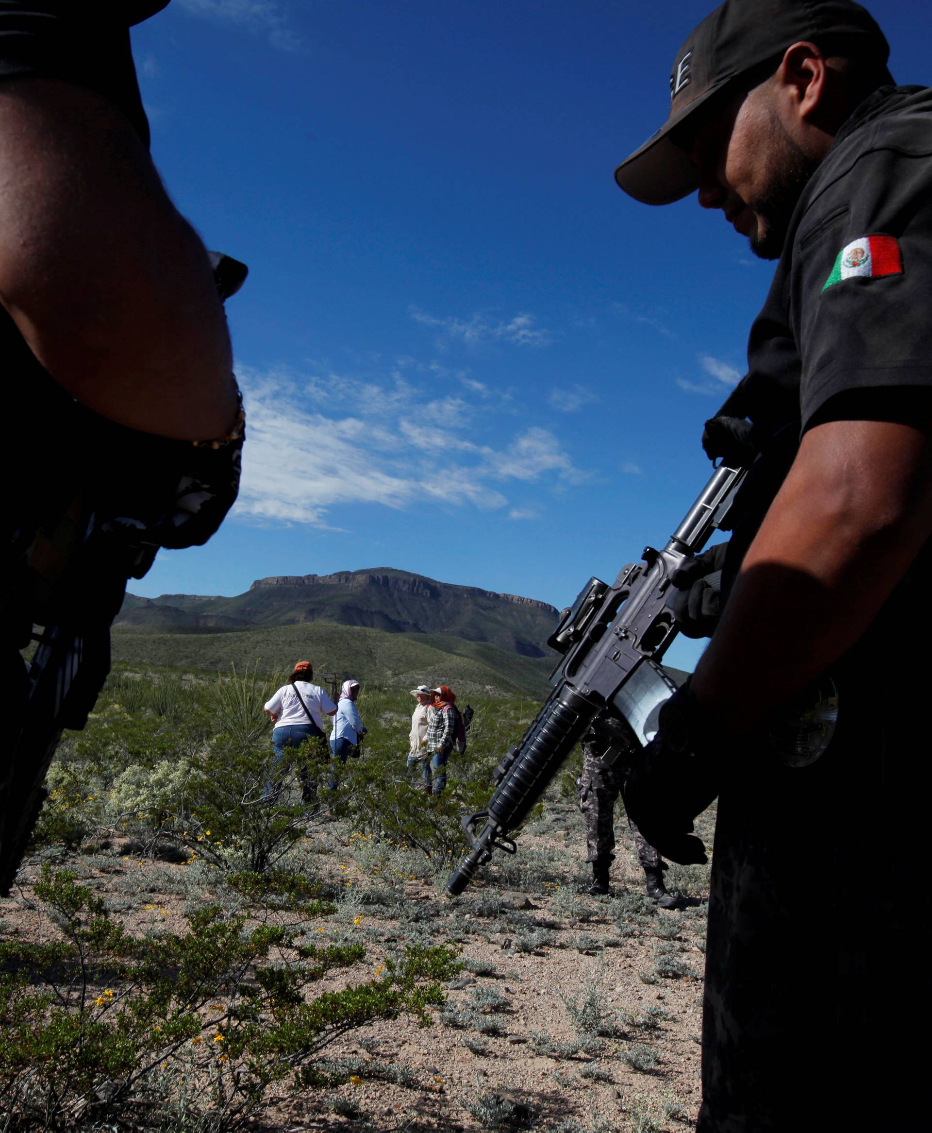 Members of Civil and Human Rights Organisations, accompanied by police officers and forensic technicians, search in the Juarez Valley for remains of women who have gone missing in the past years, on the outskirts of Ciudad Juarez