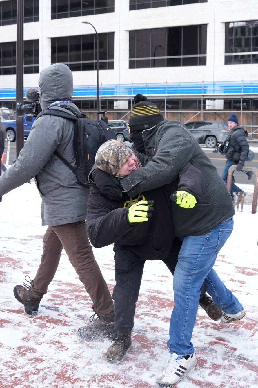 People attend the "March Against Minnesota Fraud" in Minneapolis