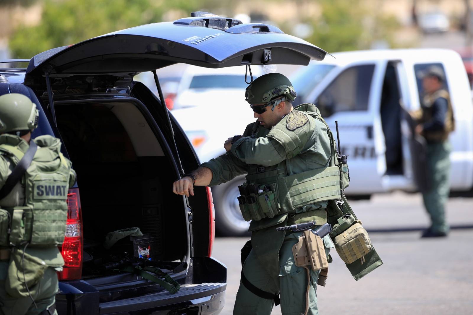 Police SWAT team members prepare after a mass shooting at a Walmart in El Paso