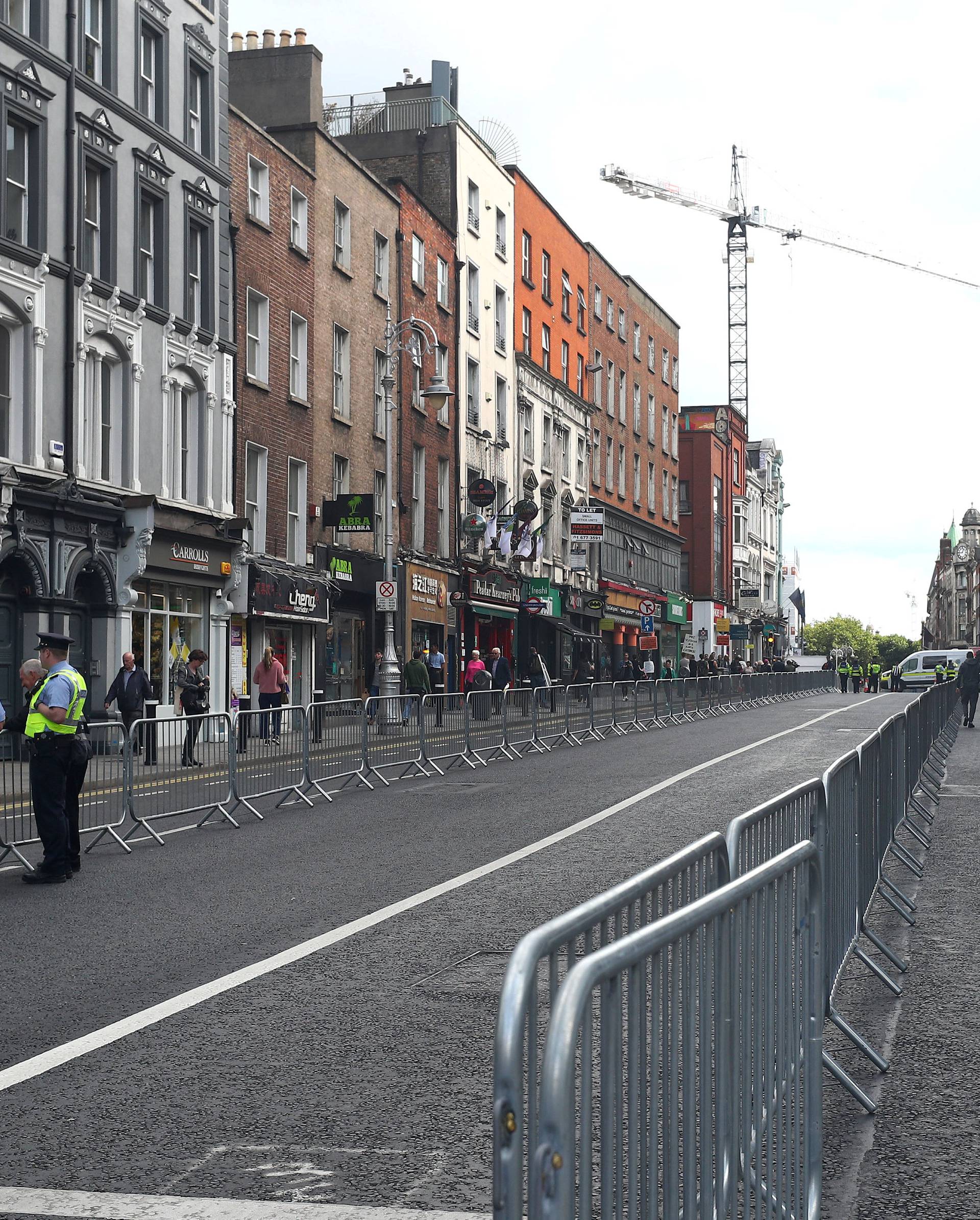 Security barriers line the route, at the start of Pope Francis' two-day visit to Ireland, in Dublin