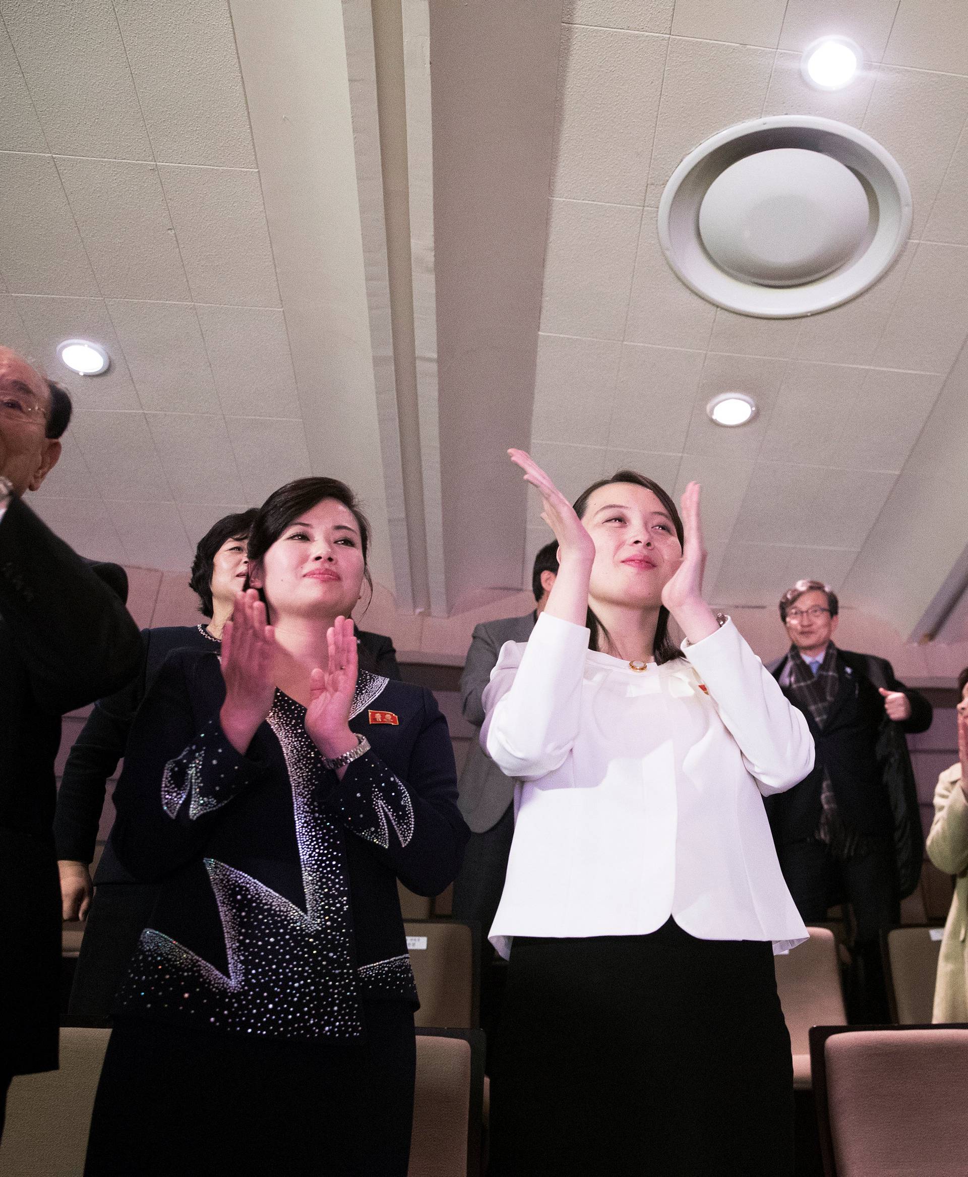 South Korean President Moon Jae-in and Kim Yo Jong, the sister of North Korea's leader Kim Jong Un, applaud after watching North Korea's Samjiyon Orchestra's performance in Seoul