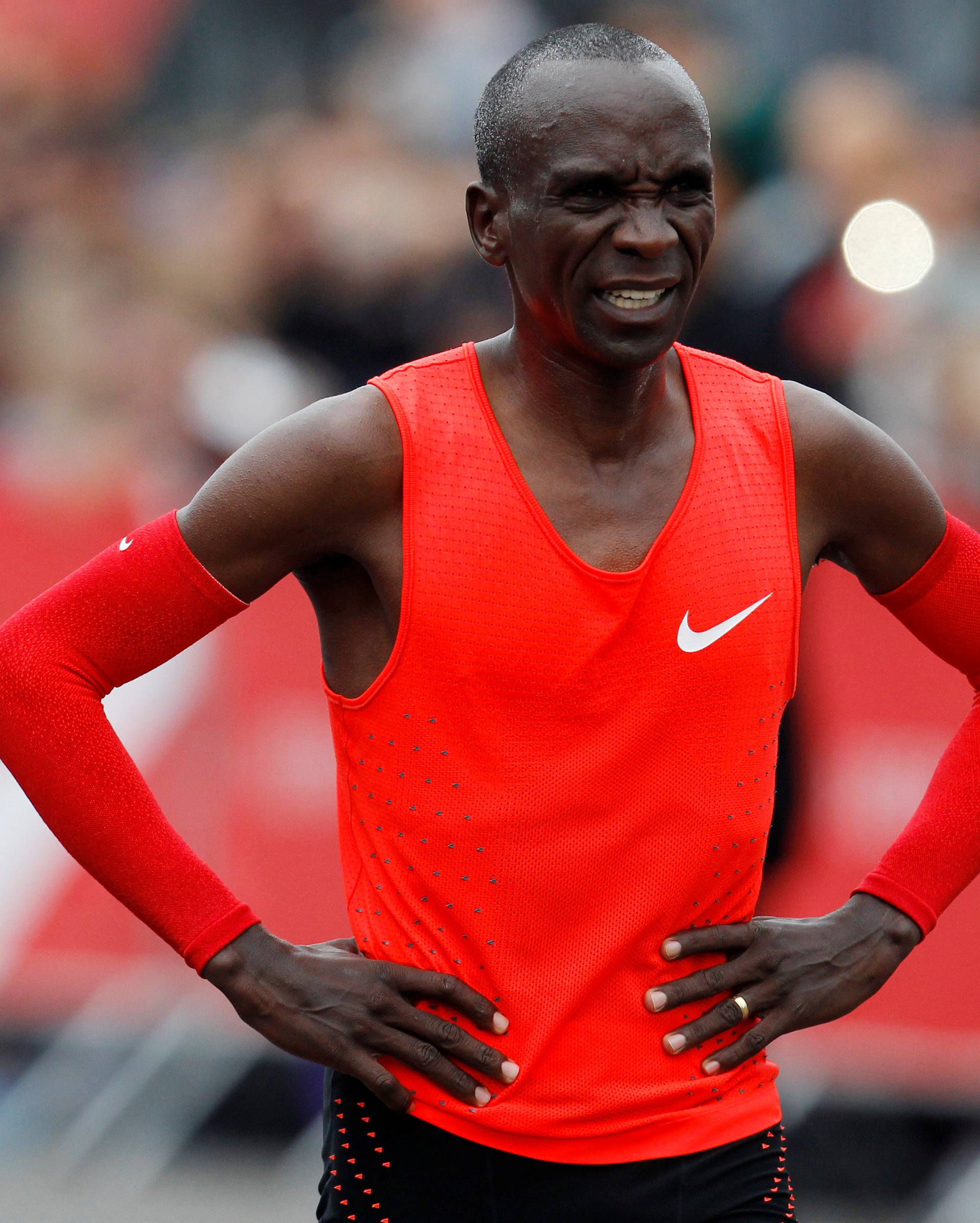 Kipchoge reacts after crossing  the finish line during an attempt to break the two-hour marathon barrier at the Monza circuit.