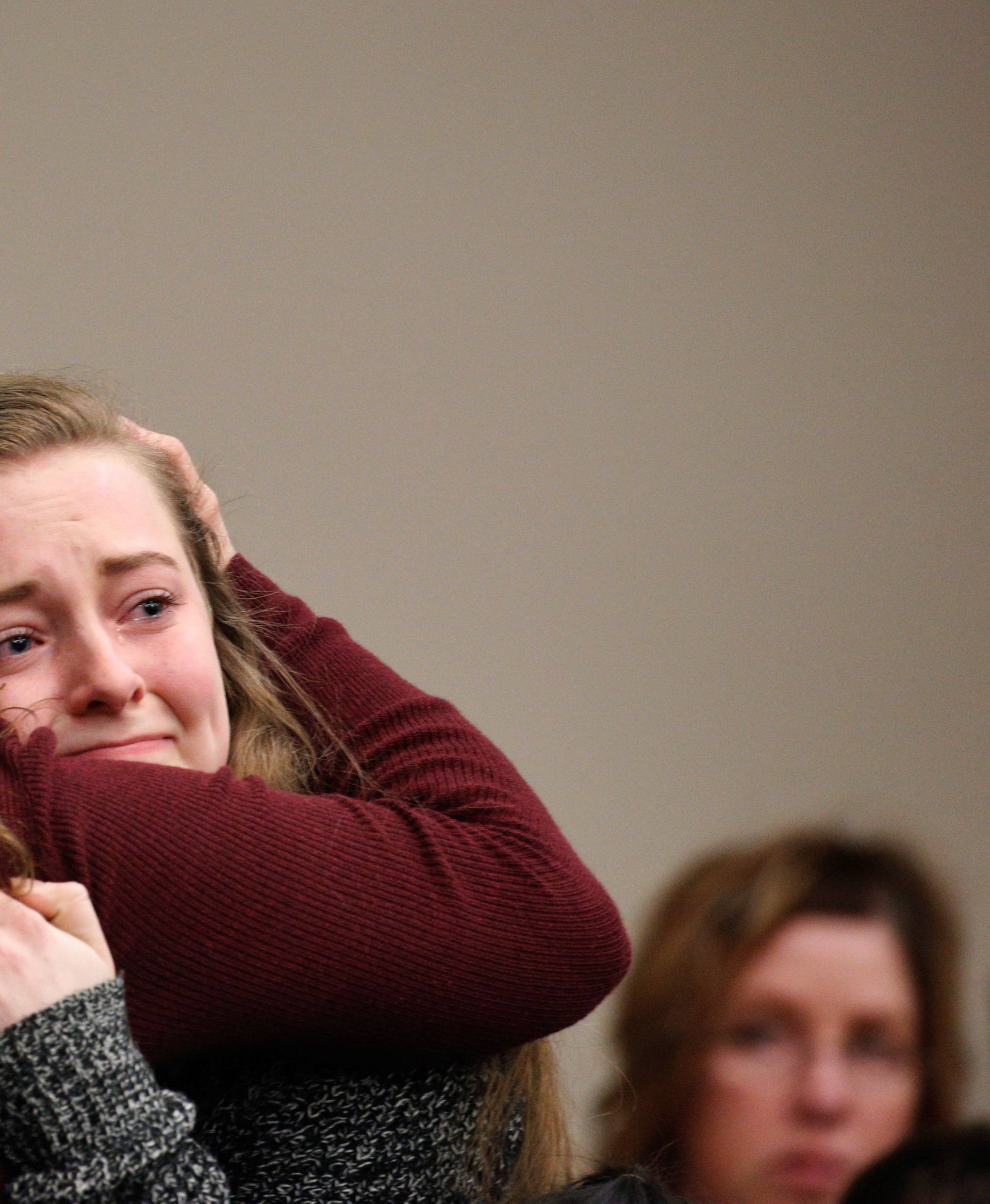 Victim Brooke Hylek is hugged by family members after speaking at the sentencing hearing for Larry Nassar, a former team USA Gymnastics doctor who pleaded guilty in November 2017 to sexual assault charges, in Lansing, Michigan