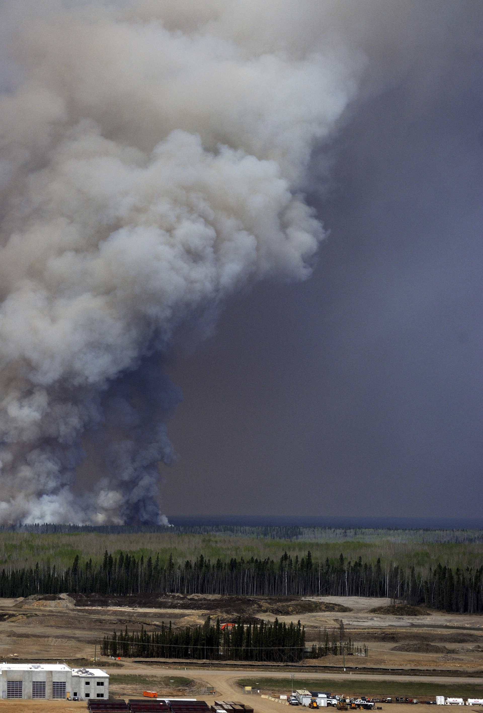 A Canadian Joint Operations Command aerial photo shows wildfires near neighborhoods in Fort McMurray Alberta Canada