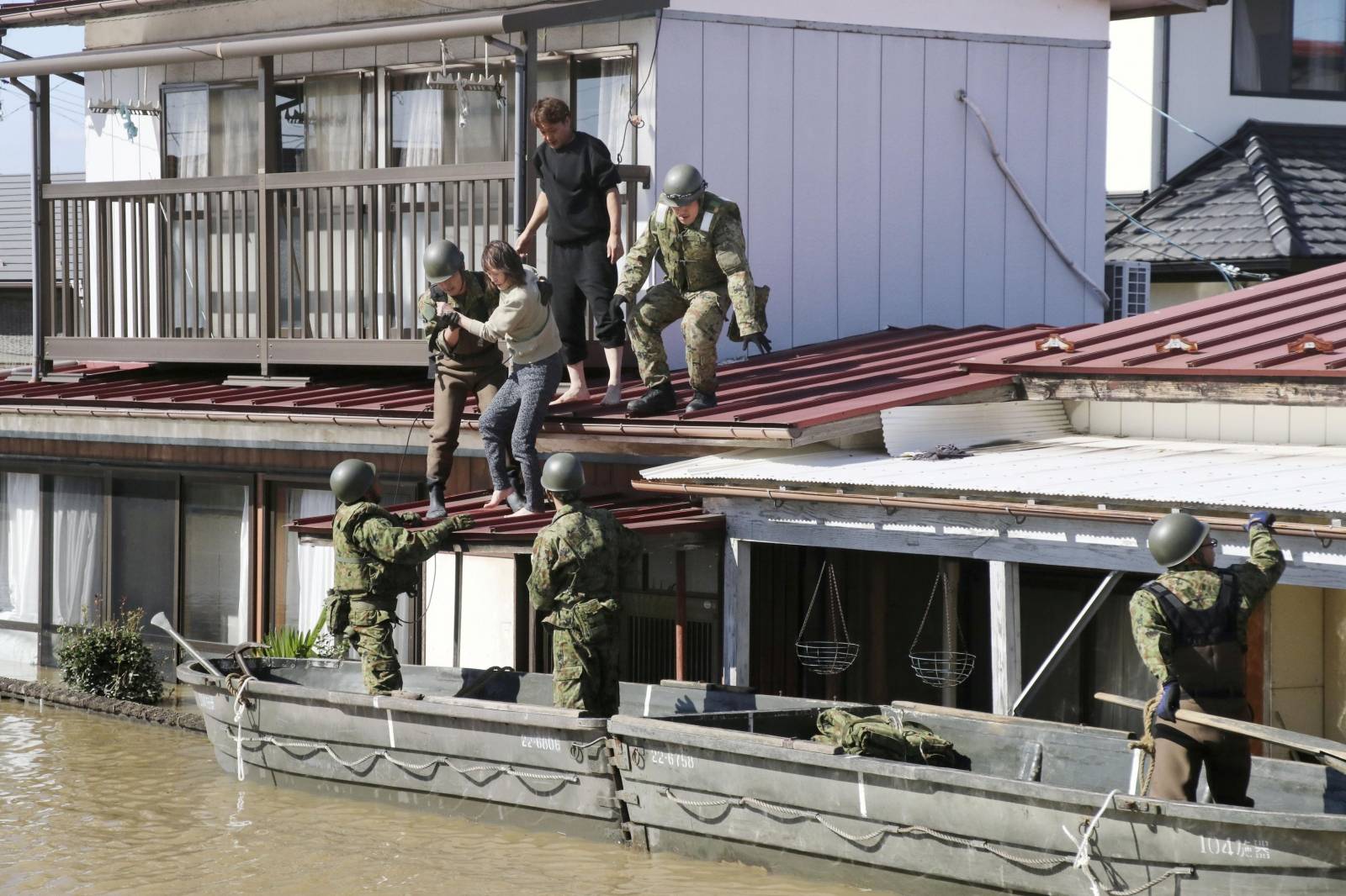 Local residents are rescued by Japapnese Defence-Force soldiers from a flooded area caused by Typhoon Hagibis in Kakuda