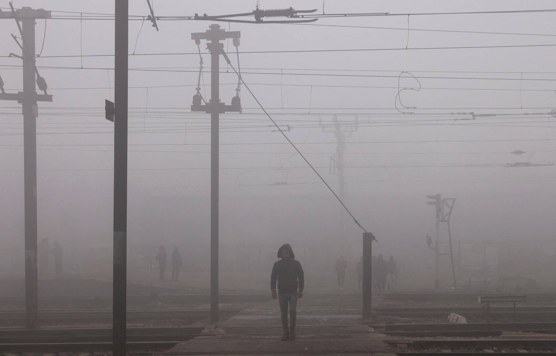 Railway tracks amidst heavy fog on a cold winter morning in New Delhi