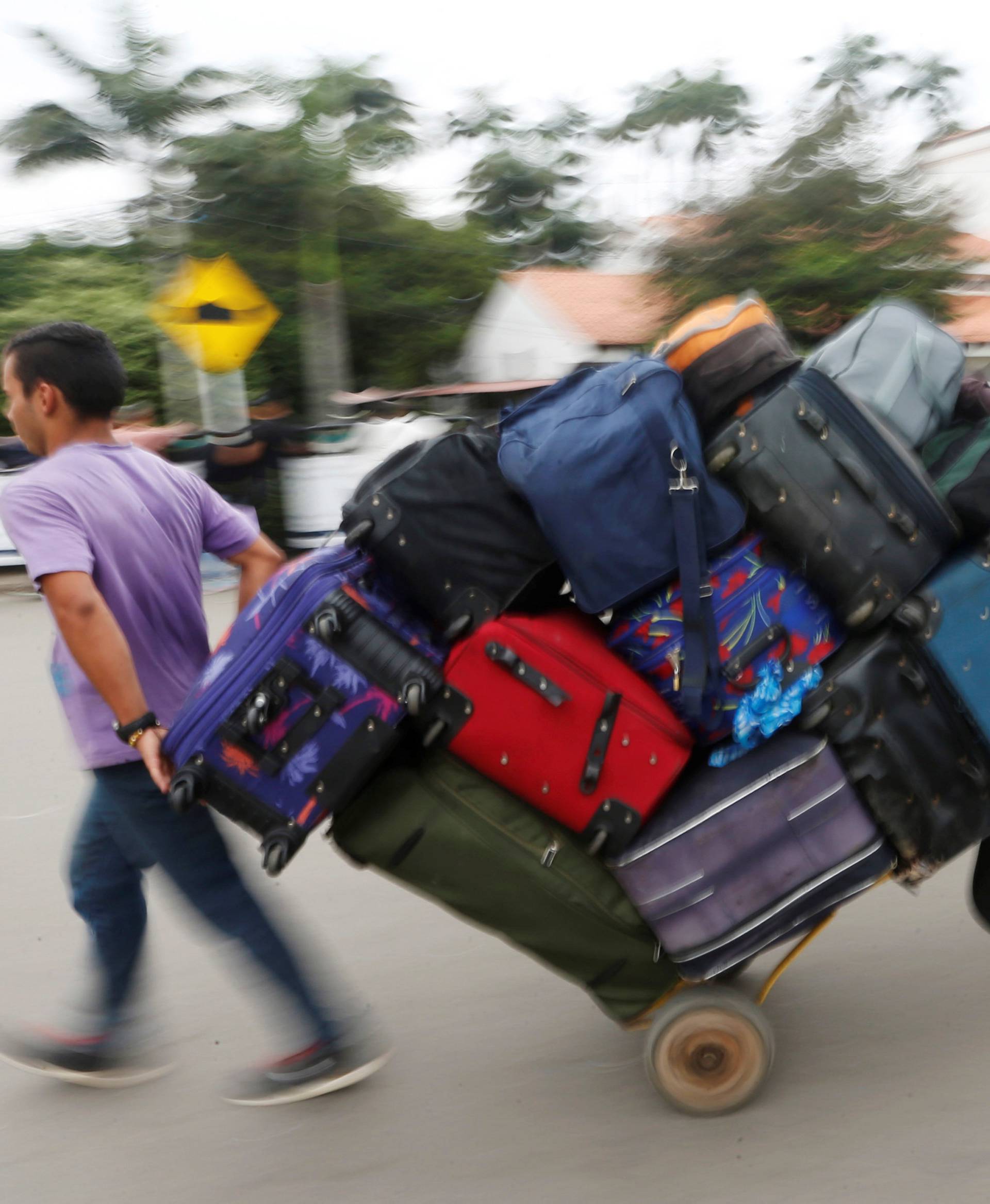 People cross into Venezuela over the Simon Bolivar international bridge in Cucuta