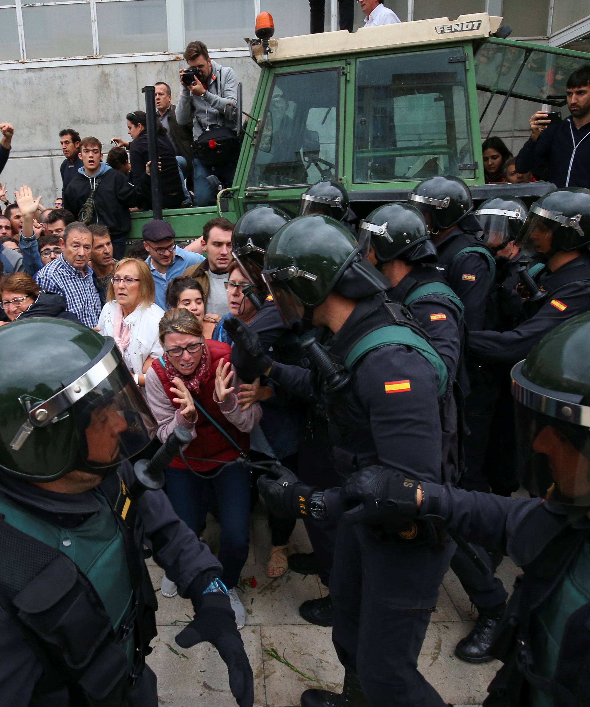 Scuffles break out with officers outside polling station for Catalonia referendum in Sant Julia de Ramis