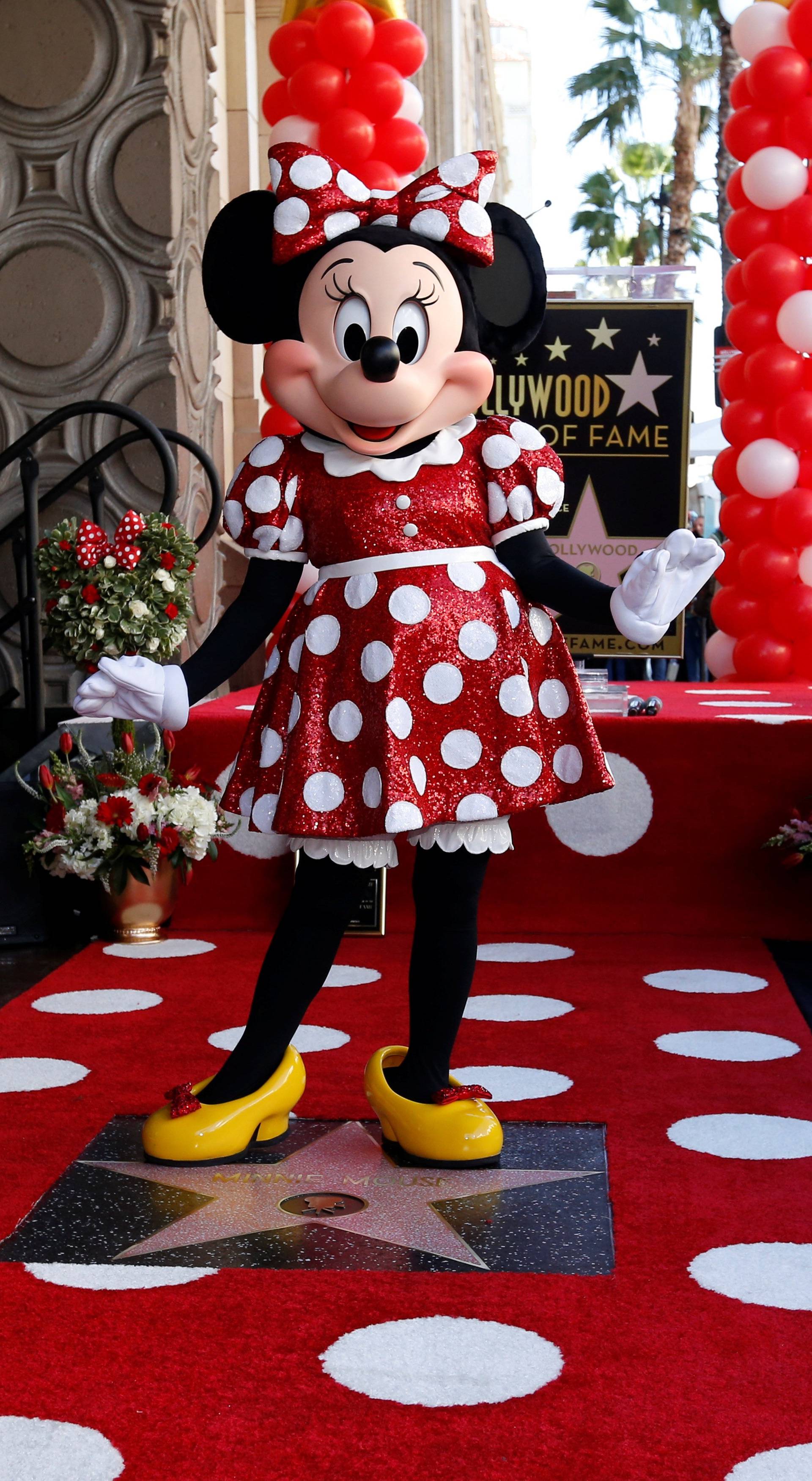 The character of Minnie Mouse poses on her star after it was unveiled on the Hollywood Walk of Fame in Los Angeles