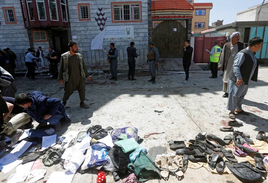 Clothes and sandals are seen at the site of a suicide bomb attack in Kabul