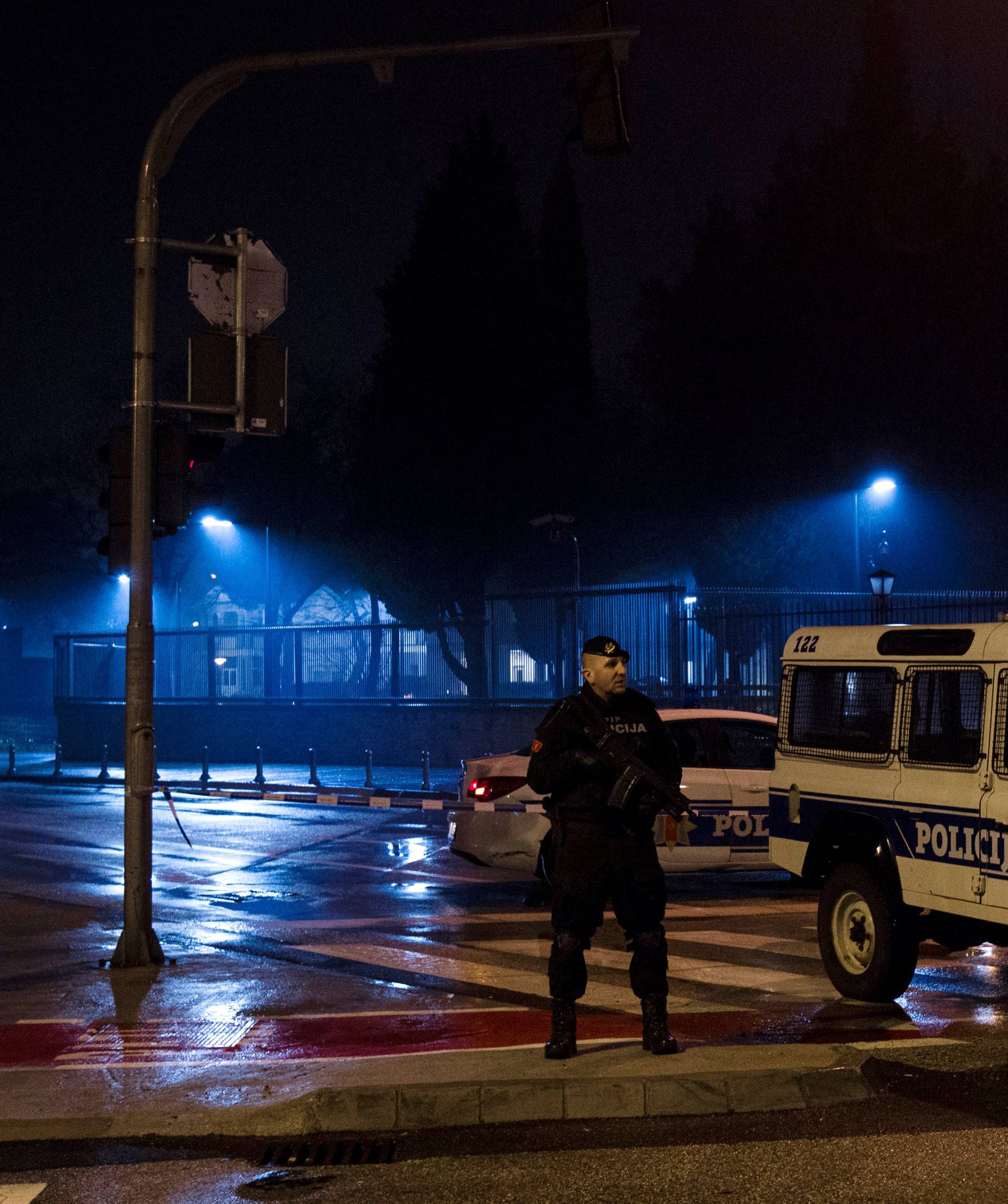 Police guard the entrance to the United States embassy building in Podgorica